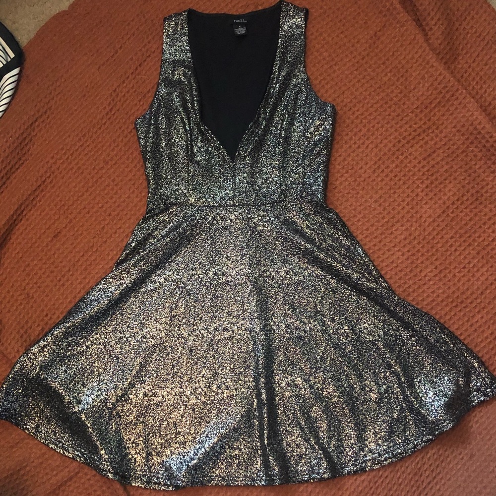 Silver shimmery v neck dress.